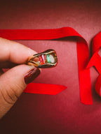 Metropolis Ring  On maroon background 