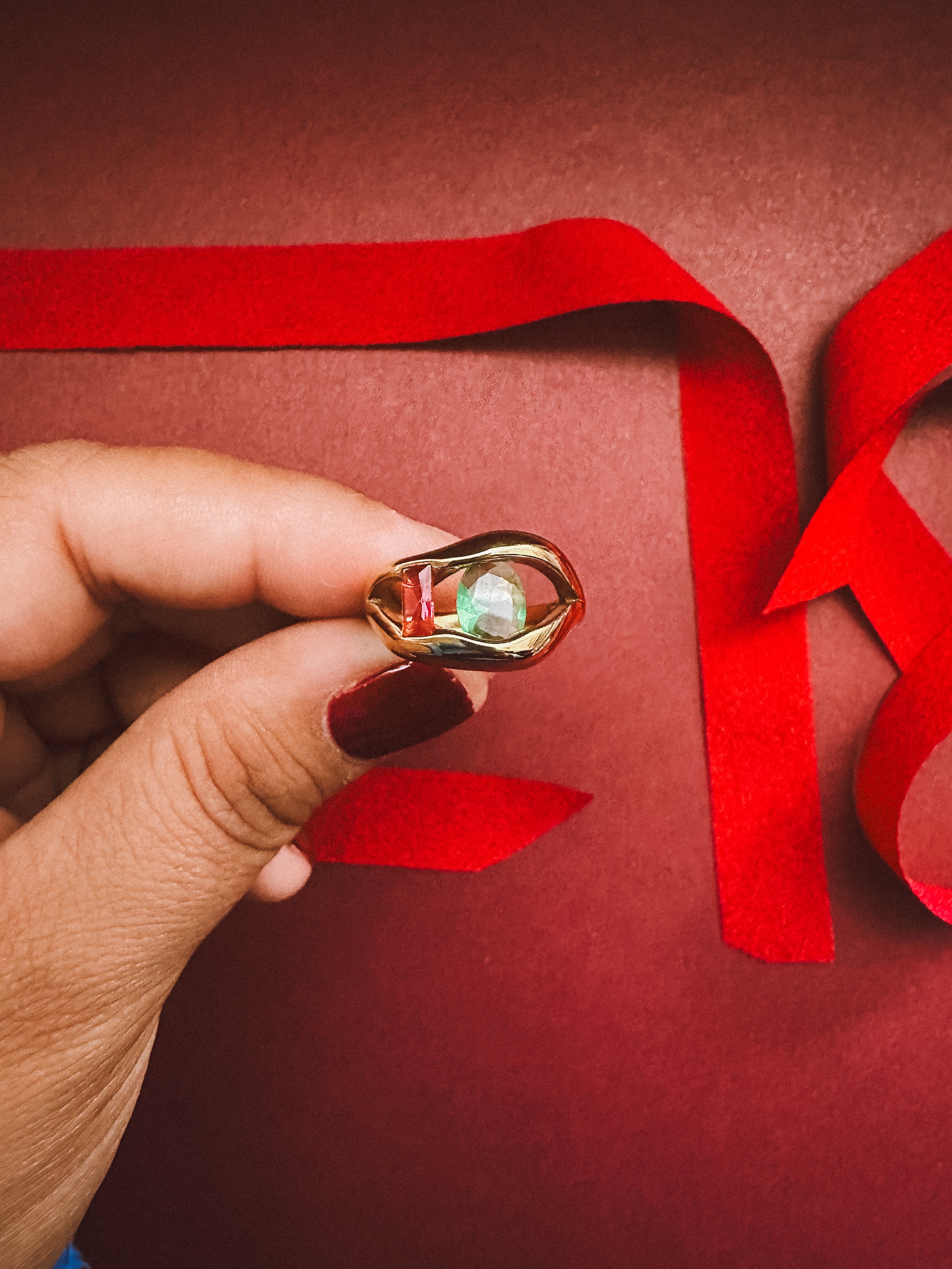 Metropolis Ring  On maroon background 