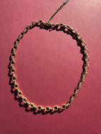 Cable link necklace On maroon background 